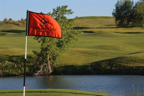 Fox Hollow flag on green near water